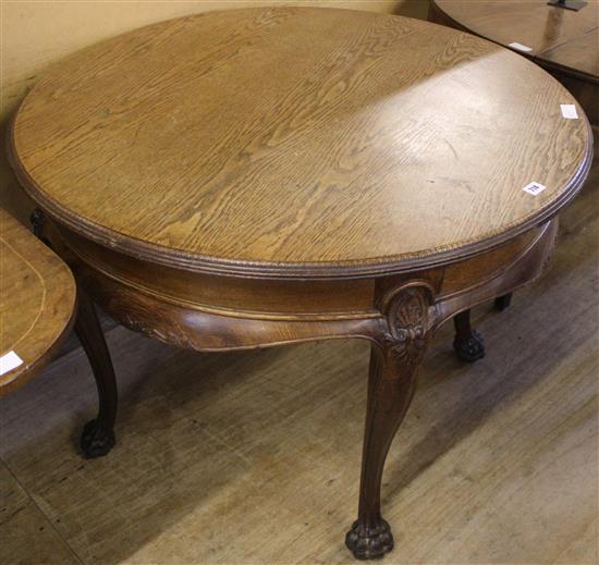 French circular oak centre/dining table, on claw feet